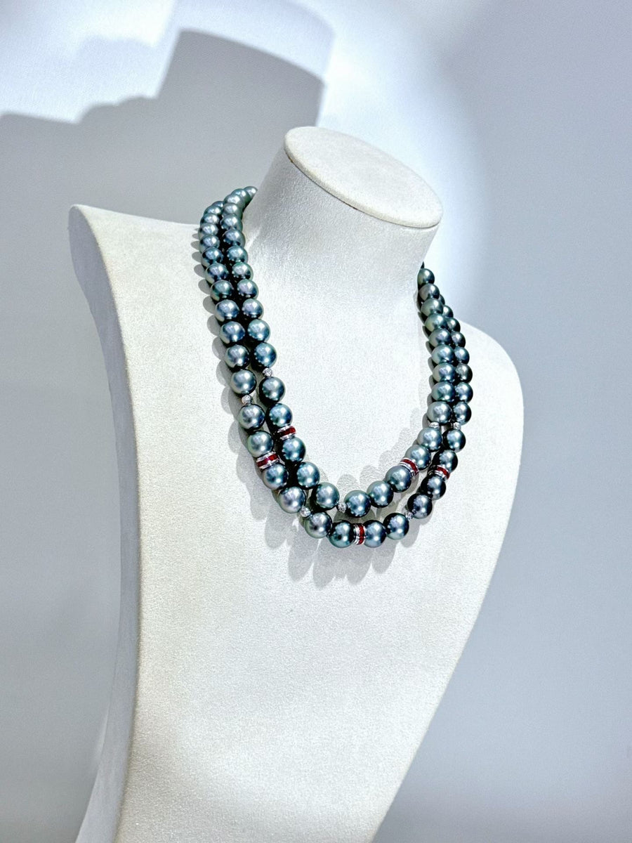 Double-layer Tahitian pearl and ruby necklace, 8.4–10.8mm pearls with mirror luster and 18K gold. A refined, layered statement piece.